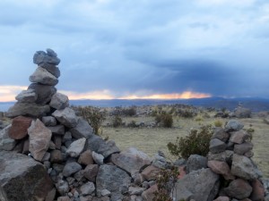 Stone art and a storm on Amantani Island.