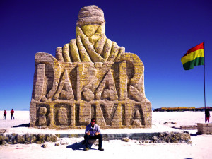 In the Salt Flats, in front of a statue celebrating a huge race held in South America. 