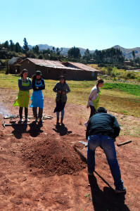 Step 11: Completely cover the stone, food, muña, corn hust, cloth and plastic heap with Earth. 